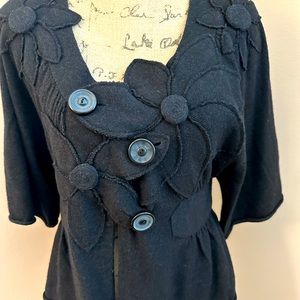 Black asymmetrical, floral short sleeve sweater.